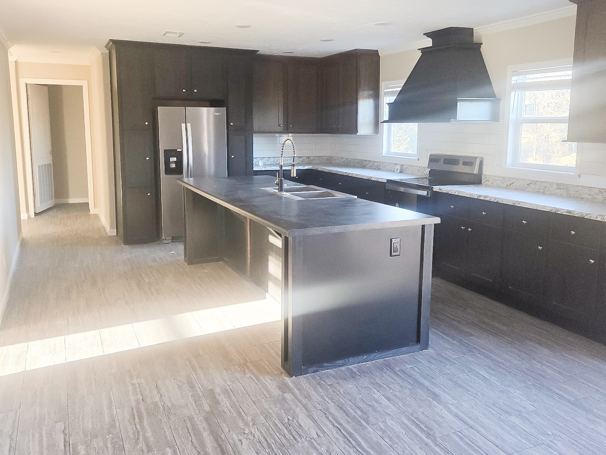 2408 Highway 79 Buffalo, TX 75831 - Photo 10 of 17 a kitchen with kitchen island granite countertop a sink cabinets and stainless steel appliances