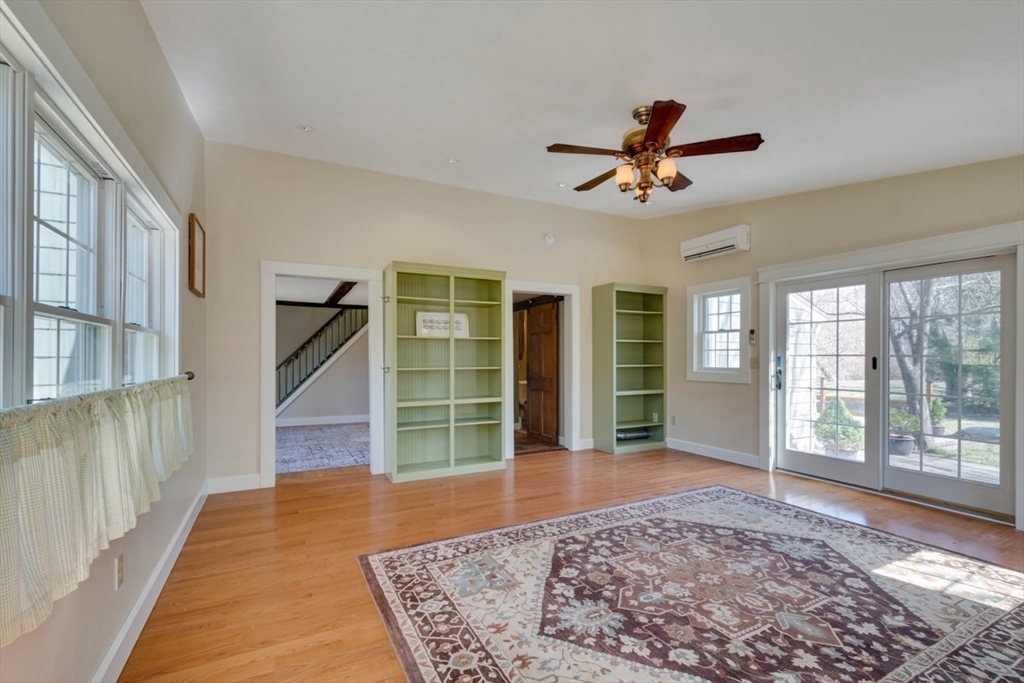 232 Randall Road Berlin, MA 01503 - Photo 12 of 35 a view of a livingroom with wooden floor and a ceiling fan