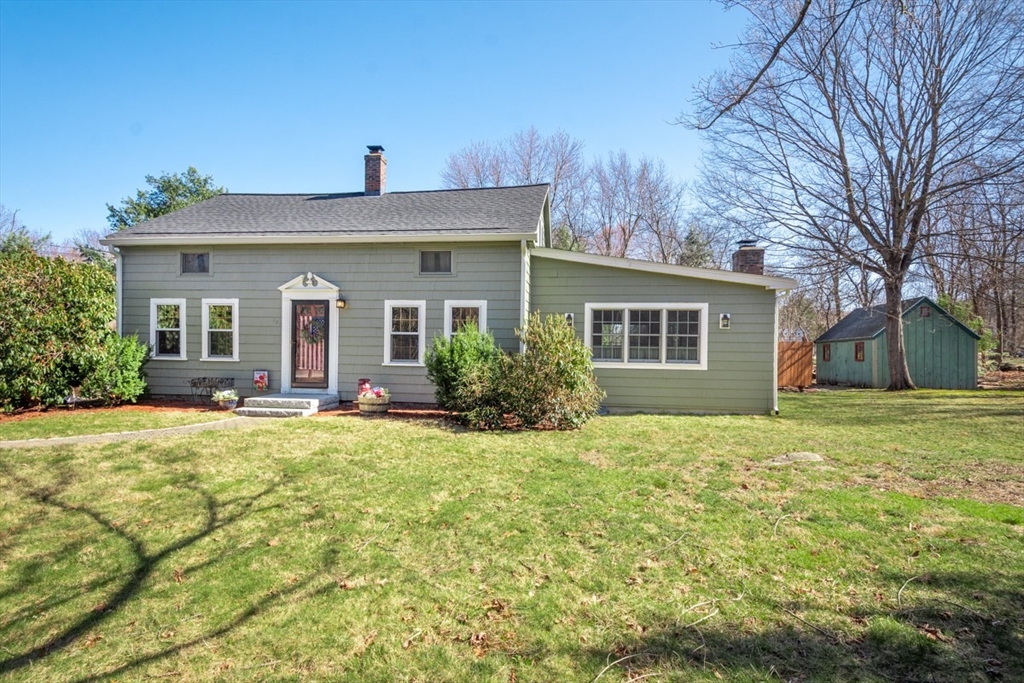 232 Randall Road Berlin, MA 01503 - Photo 3 of 35 a front view of house with yard and trees around