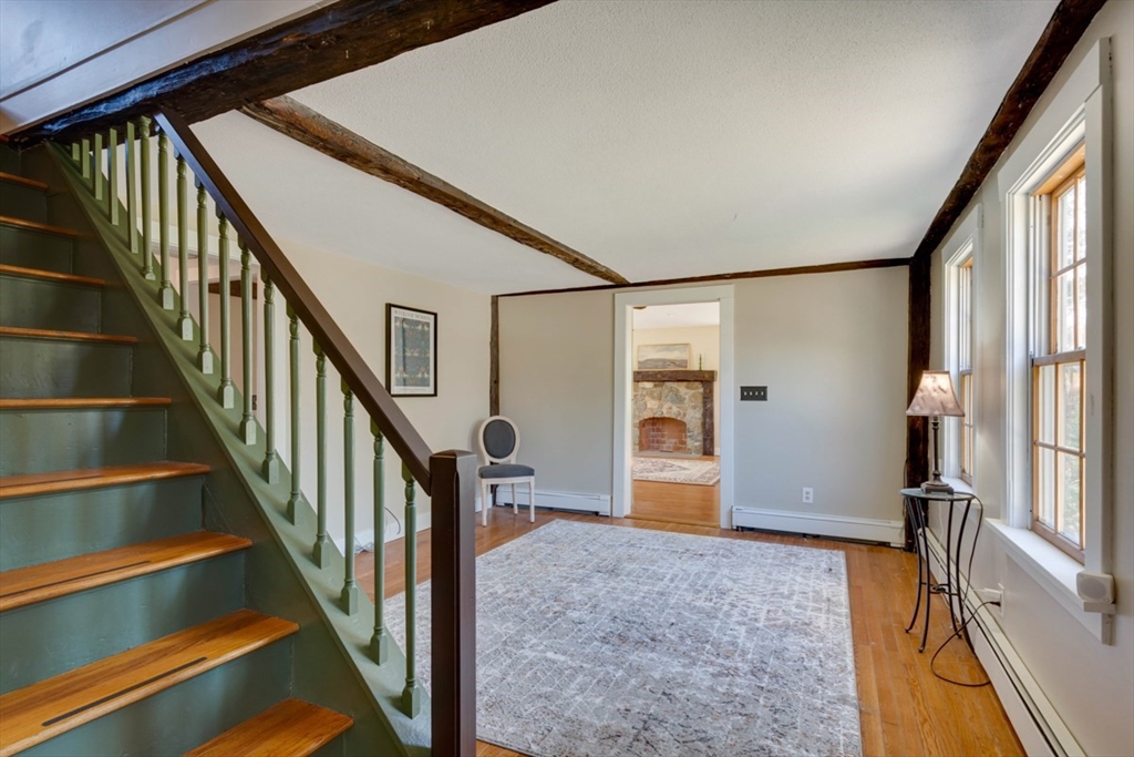 232 Randall Road Berlin, MA 01503 - Photo 4 of 35 a view of an entryway with wooden floor and staircase