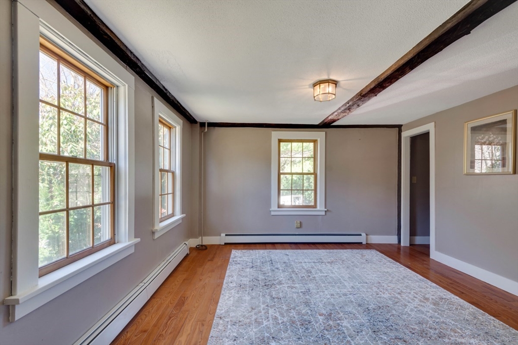232 Randall Road Berlin, MA 01503 - Photo 7 of 35 a view of an empty room with a window