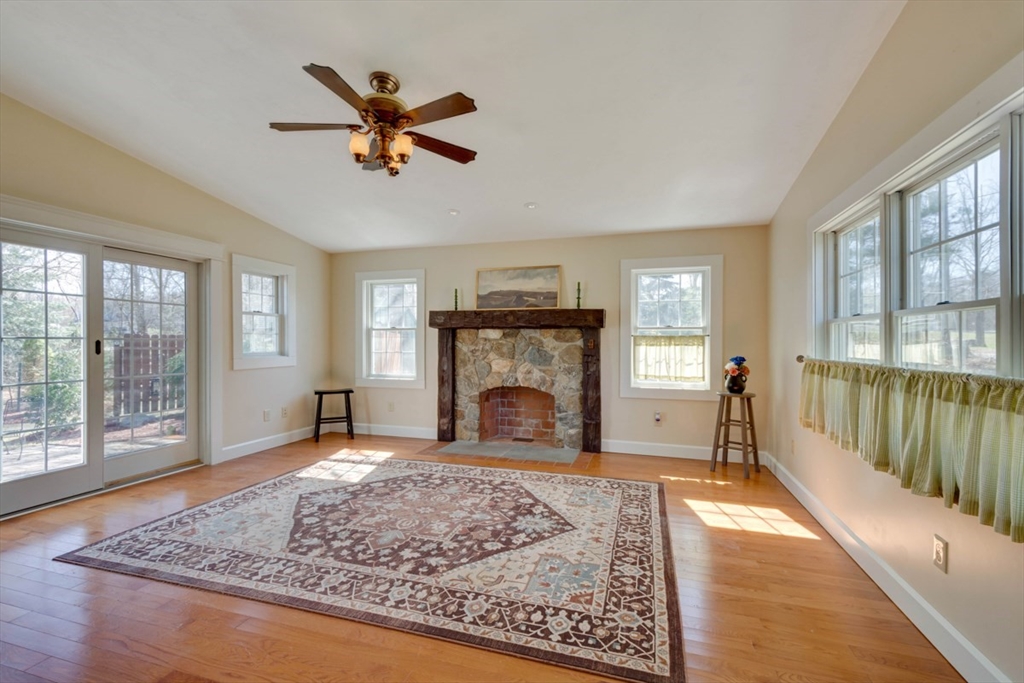 232 Randall Road Berlin, MA 01503 - Photo 10 of 35 a view of a livingroom with a fireplace window and wooden floor