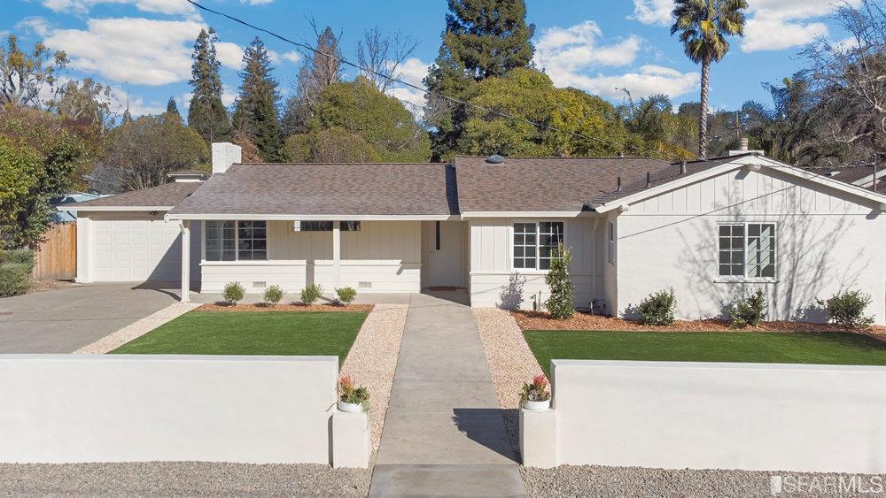 1016 Willow Drive Lafayette, CA 94549 - Photo 1 of 34 a front view of a house with a yard and garage