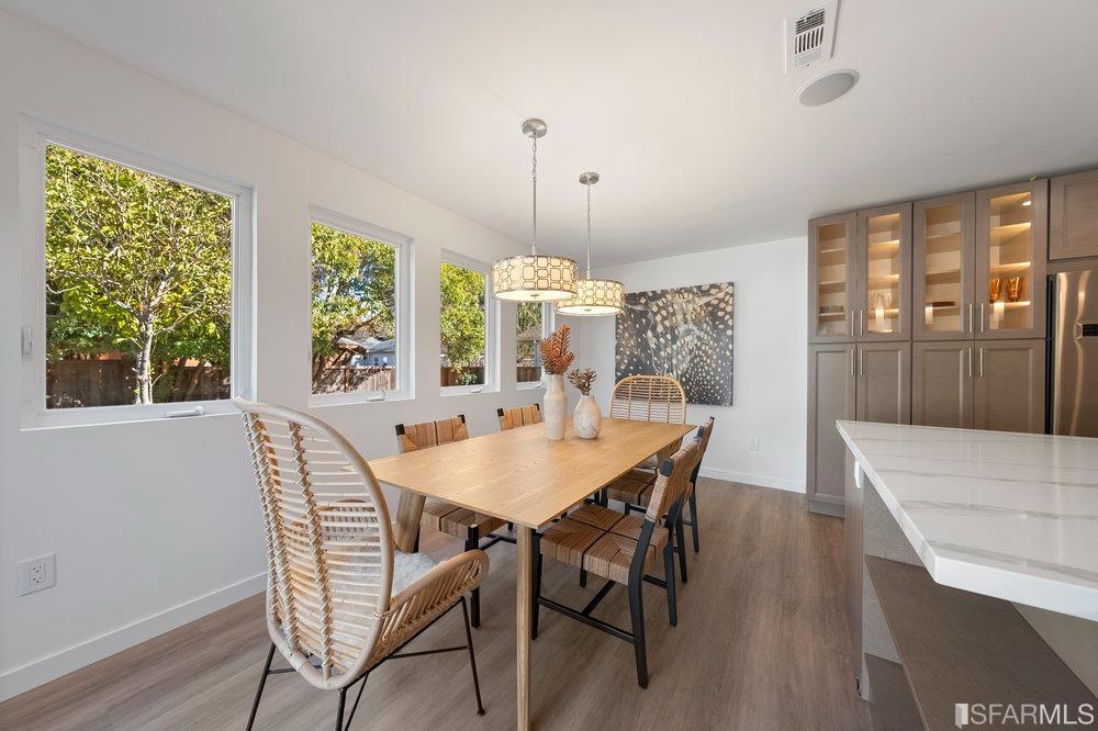 1016 Willow Drive Lafayette, CA 94549 - Photo 15 of 34 a view of a dining room with furniture window and wooden floor