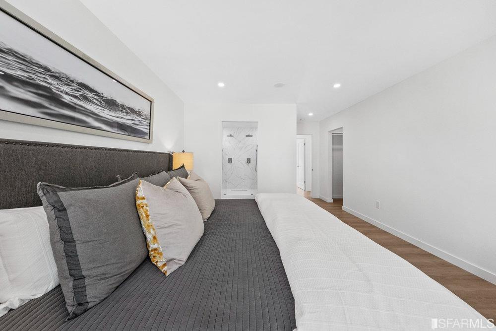 1016 Willow Drive Lafayette, CA 94549 - Photo 22 of 34 a bed room with a bed and a painting on the wall