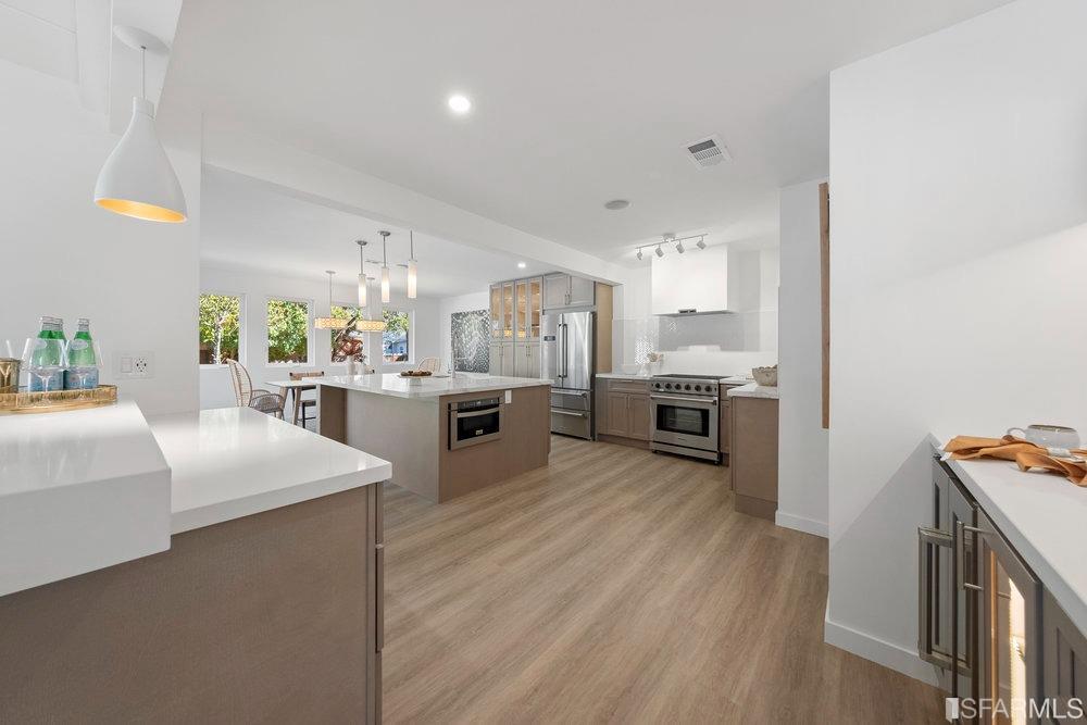 1016 Willow Drive Lafayette, CA 94549 - Photo 7 of 34 a kitchen with stainless steel appliances granite countertop a stove top oven a sink dishwasher and white cabinets with wooden floor