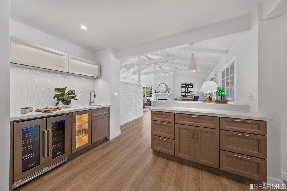 1016 Willow Drive Lafayette, CA 94549 - Photo 8 of 34 a kitchen with stainless steel appliances white cabinets and wooden floor