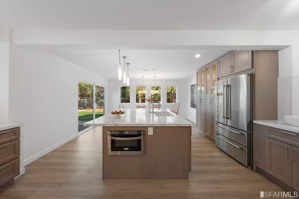 1016 Willow Drive Lafayette, CA 94549 - Photo 9 of 34 a view with kitchen island a sink appliances and cabinets