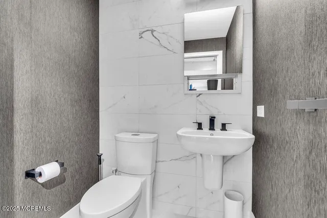 a balcony with furniture and a potted plant