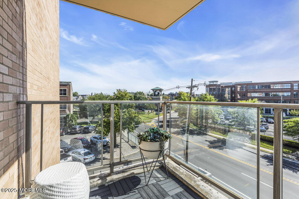 28 Riverside Avenue, Unit 2G Red Bank, NJ 07701 - Photo 21 of 34 a view of a balcony with lake view and a floor to ceiling window
