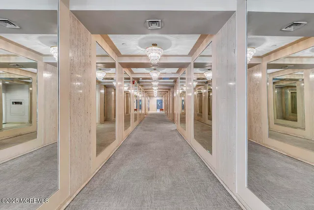 a view of parking garage with cars