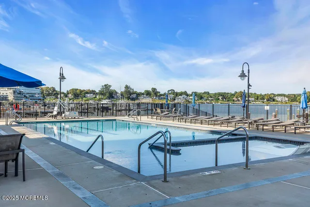 a view of a swimming pool with a lounge chair