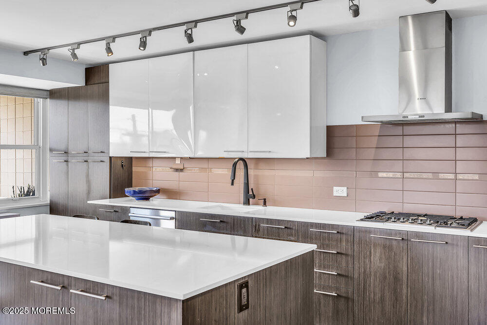 28 Riverside Avenue, Unit 2G Red Bank, NJ 07701 - Photo 6 of 34 a kitchen with a sink a stove and cabinets