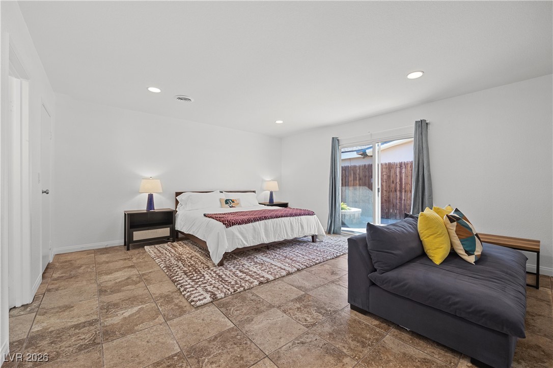 1554 Raindance Way Las Vegas, NV 89169 - Photo 14 of 25 Bedroom featuring access to exterior, baseboards, and recessed lighting
