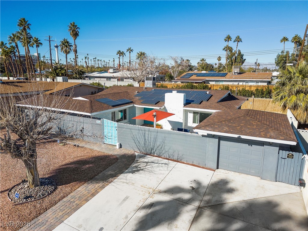 1554 Raindance Way Las Vegas, NV 89169 - Photo 24 of 25 View of patio / terrace featuring a garage, a fenced front yard, a gate, and concrete driveway
