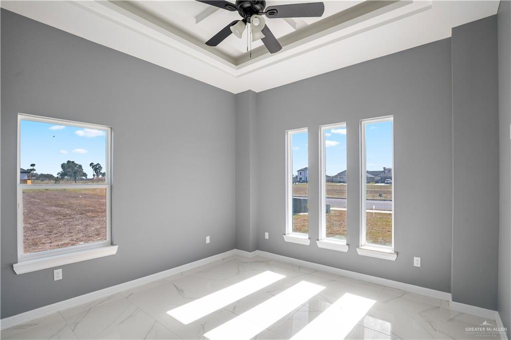 1402 Tee Box Drive Weslaco, TX 78596 - Photo 11 of 20 a view of an empty room with a window