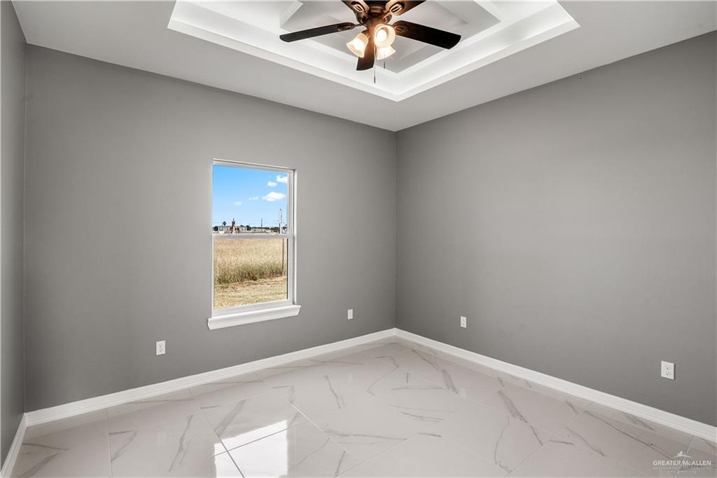 1402 Tee Box Drive Weslaco, TX 78596 - Photo 13 of 20 a view of an empty room with a window