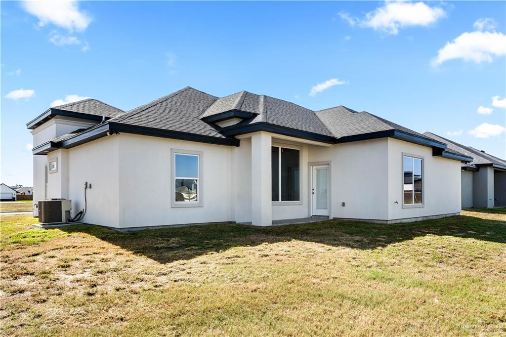 1402 Tee Box Drive Weslaco, TX 78596 - Photo 16 of 20 a house with a outdoor space