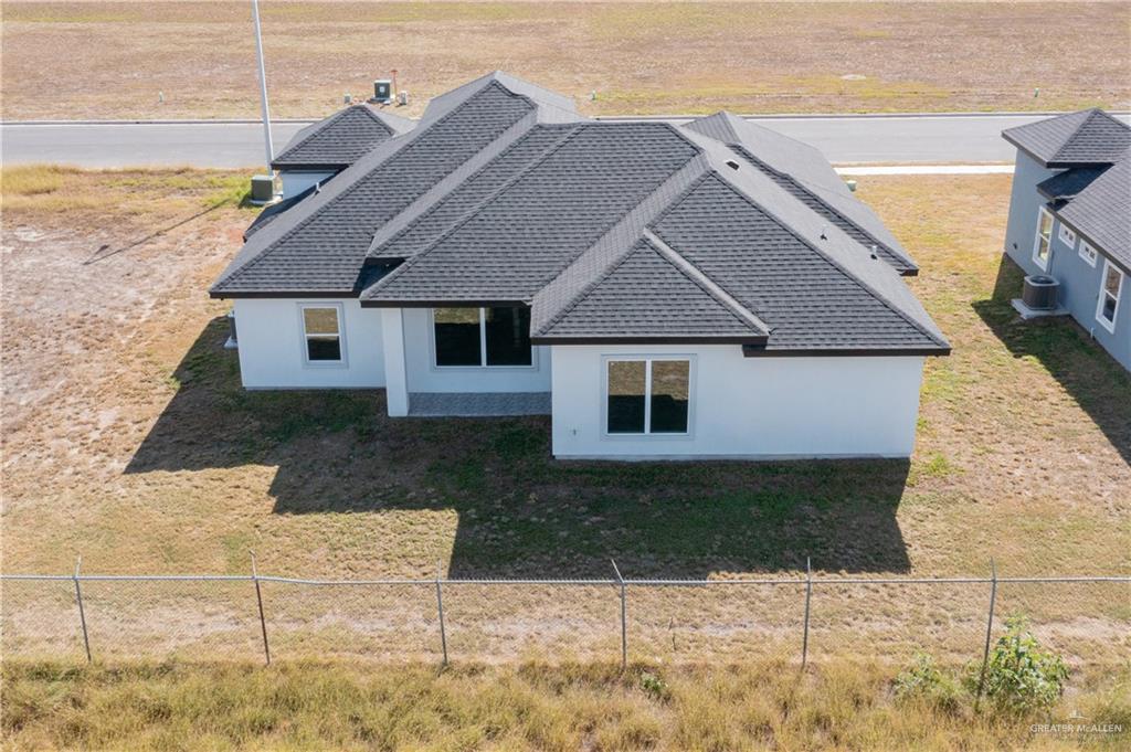 1402 Tee Box Drive Weslaco, TX 78596 - Photo 17 of 20 a house view with a backyard space