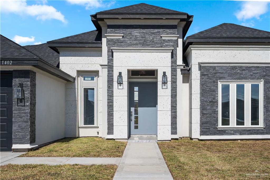 1402 Tee Box Drive Weslaco, TX 78596 - Photo 2 of 20 a view of a house with a door