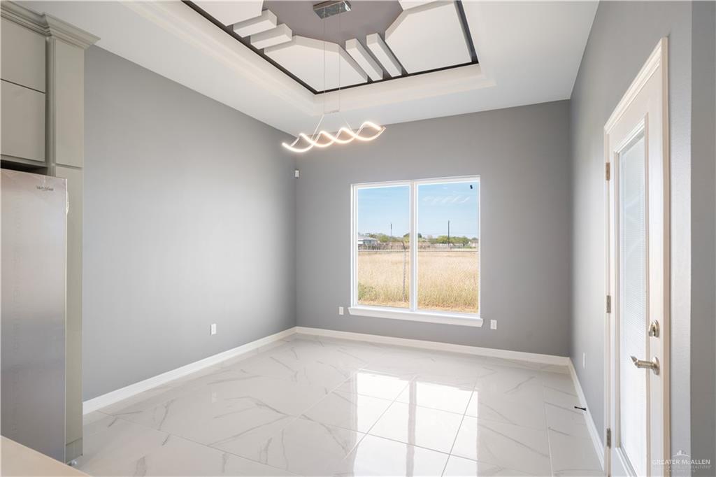 1402 Tee Box Drive Weslaco, TX 78596 - Photo 7 of 20 a view of an empty room with a window