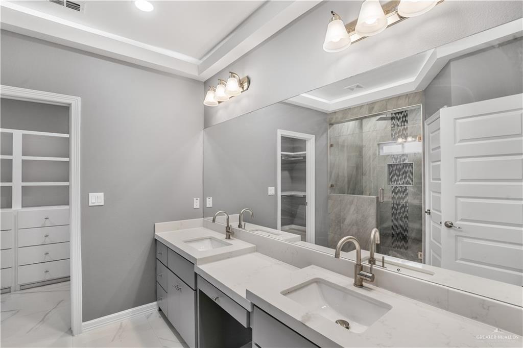 1402 Tee Box Drive Weslaco, TX 78596 - Photo 9 of 20 a bathroom with a sink and a mirror