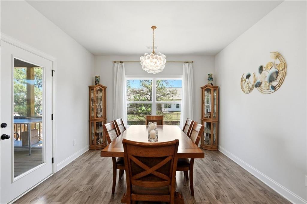 449 Banff Drive Winder, GA 30680 - Photo 15 of 56 a view of a dining room with furniture window and outside view