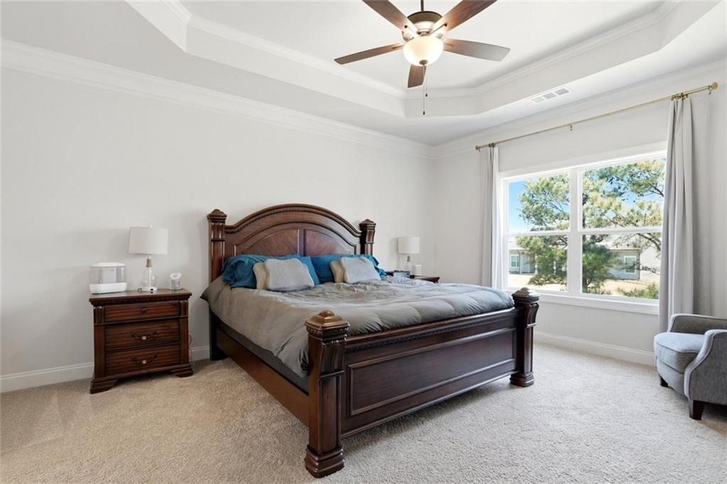 449 Banff Drive Winder, GA 30680 - Photo 17 of 56 a bedroom with a bed and a large window