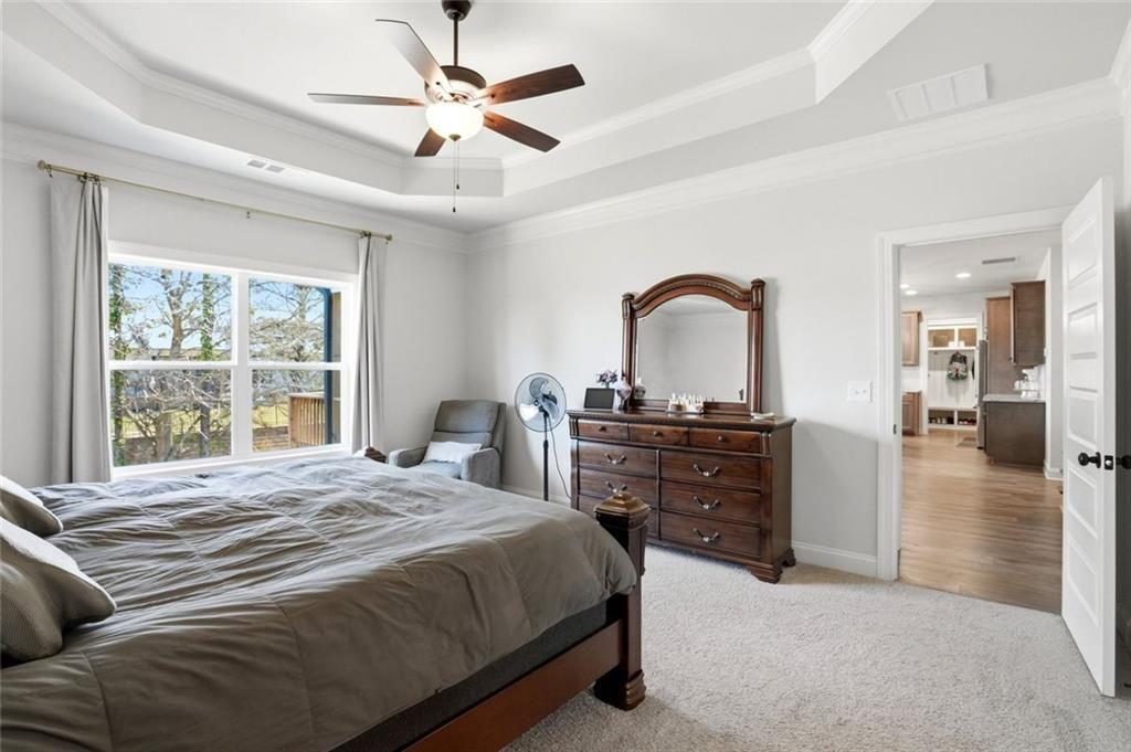 449 Banff Drive Winder, GA 30680 - Photo 18 of 56 a bedroom with a bed and a large window
