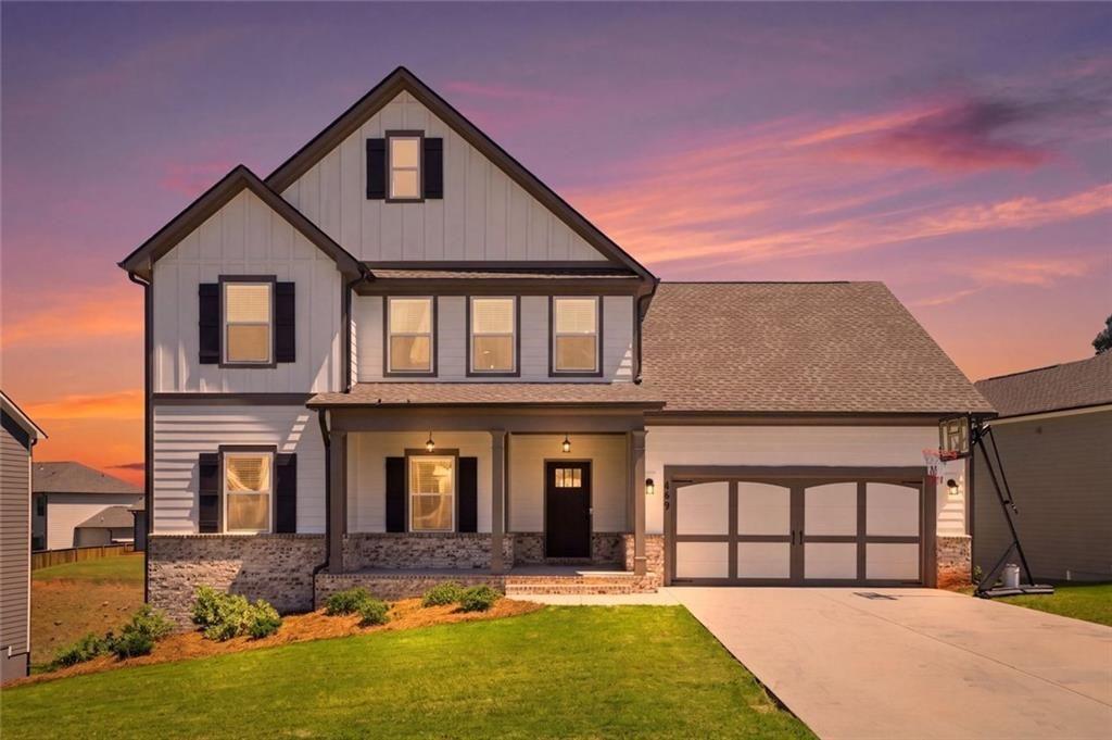 449 Banff Drive Winder, GA 30680 - Photo 2 of 56 a front view of a house with a yard