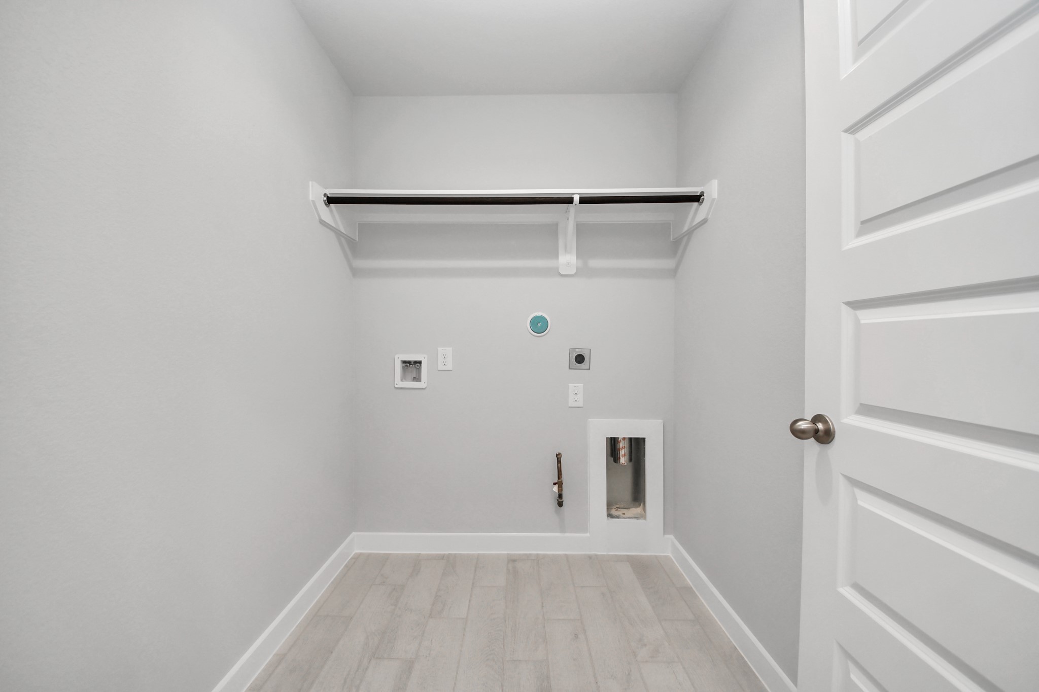 24518 Broad Park Spring, TX 77373 - Photo 28 of 29 A perfect blend of functionality and comfort. Capture the essence of easy living with a first-floor laundry room, thoughtfully equipped with shelving for effortless organization. Both electric and gas connections available. Sample photo of completed home with similar floor plan. Actual colors and selections may vary.