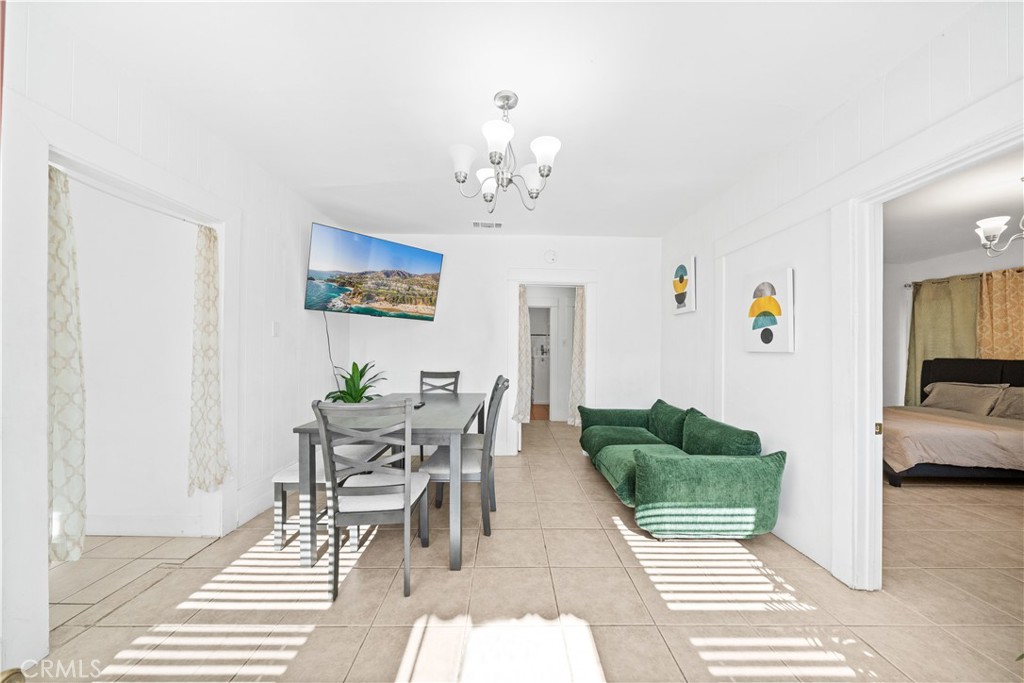 1415 South 2nd Street Alhambra, CA 91801 - Photo 2 of 58 a living room with furniture a chandelier and a dining table