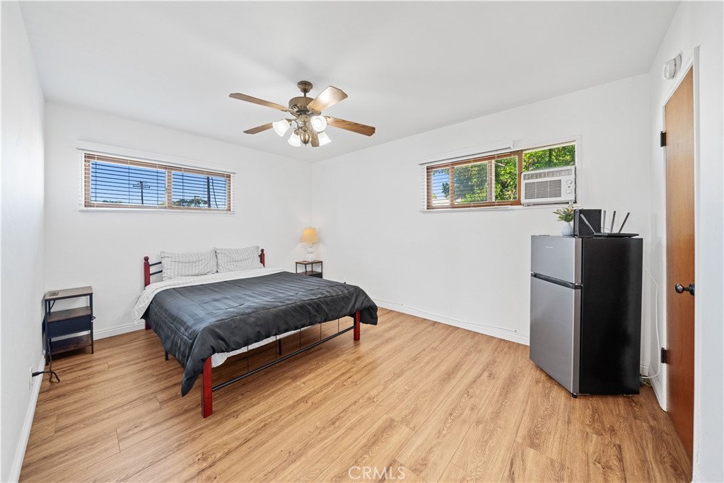 1415 South 2nd Street Alhambra, CA 91801 - Photo 43 of 58 a bedroom with a bed and a chandelier