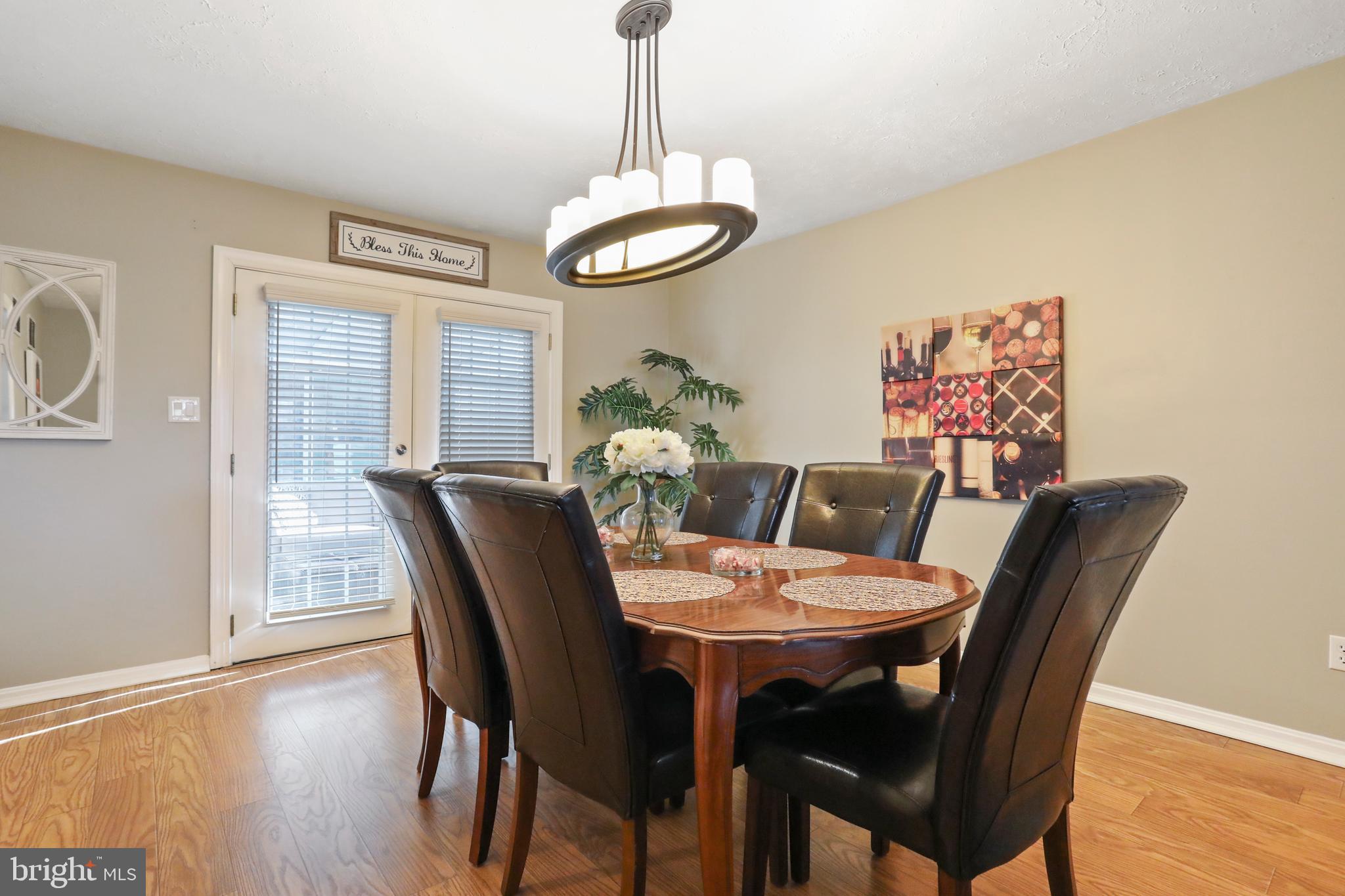 123 Gloucester Road Front Royal, VA 22630 - Photo 8 of 50 Formal dining room leading to the 4 seasons room