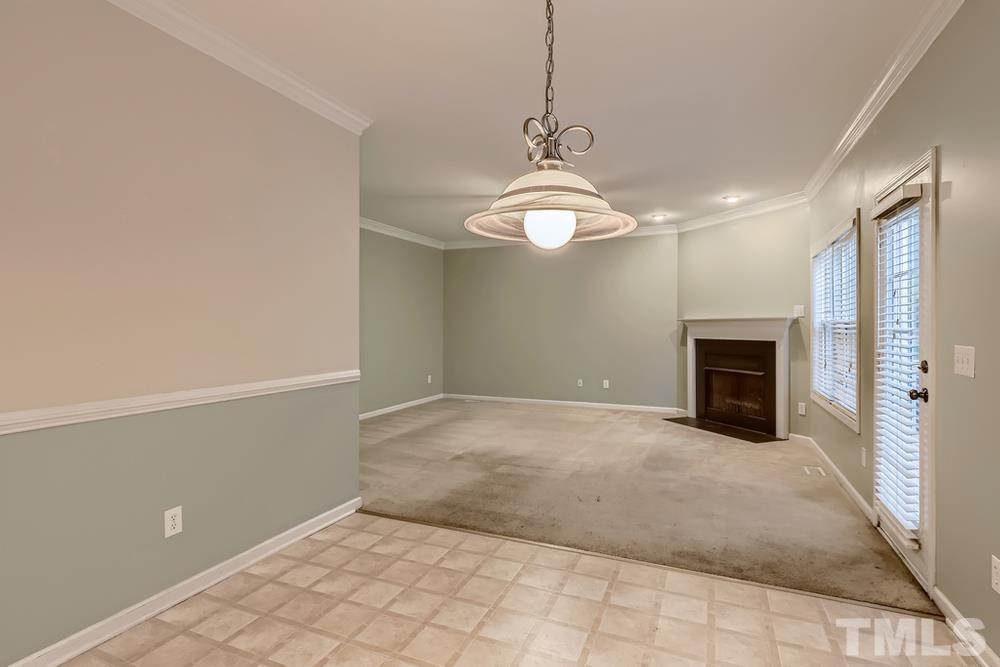 303 Whitney Lane Durham, NC 27713 - Photo 12 of 28 a view of a livingroom with a chandelier fan