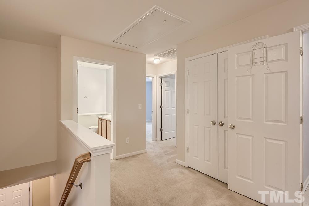 303 Whitney Lane Durham, NC 27713 - Photo 25 of 28 a view of a hallway with closet and entryway