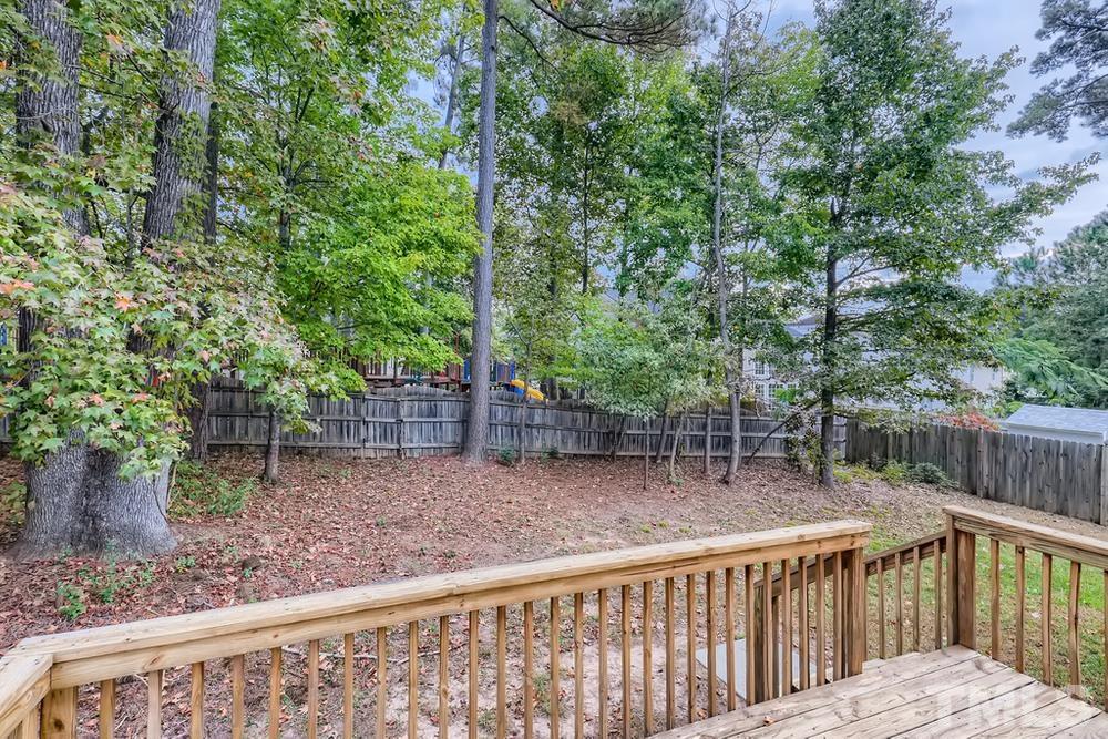 303 Whitney Lane Durham, NC 27713 - Photo 26 of 28 a view of a wooden fence and trees