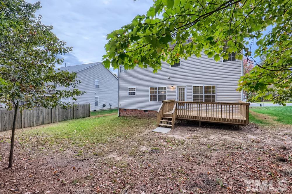 303 Whitney Lane Durham, NC 27713 - Photo 28 of 28 a view of a house with a yard and wooden fence