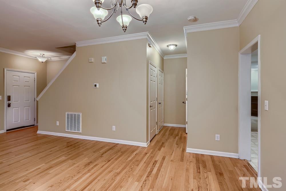 303 Whitney Lane Durham, NC 27713 - Photo 6 of 28 a view of empty room with wooden floor