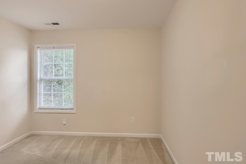 303 Whitney Lane Durham, NC 27713 - Photo 7 of 28 an empty room with a window