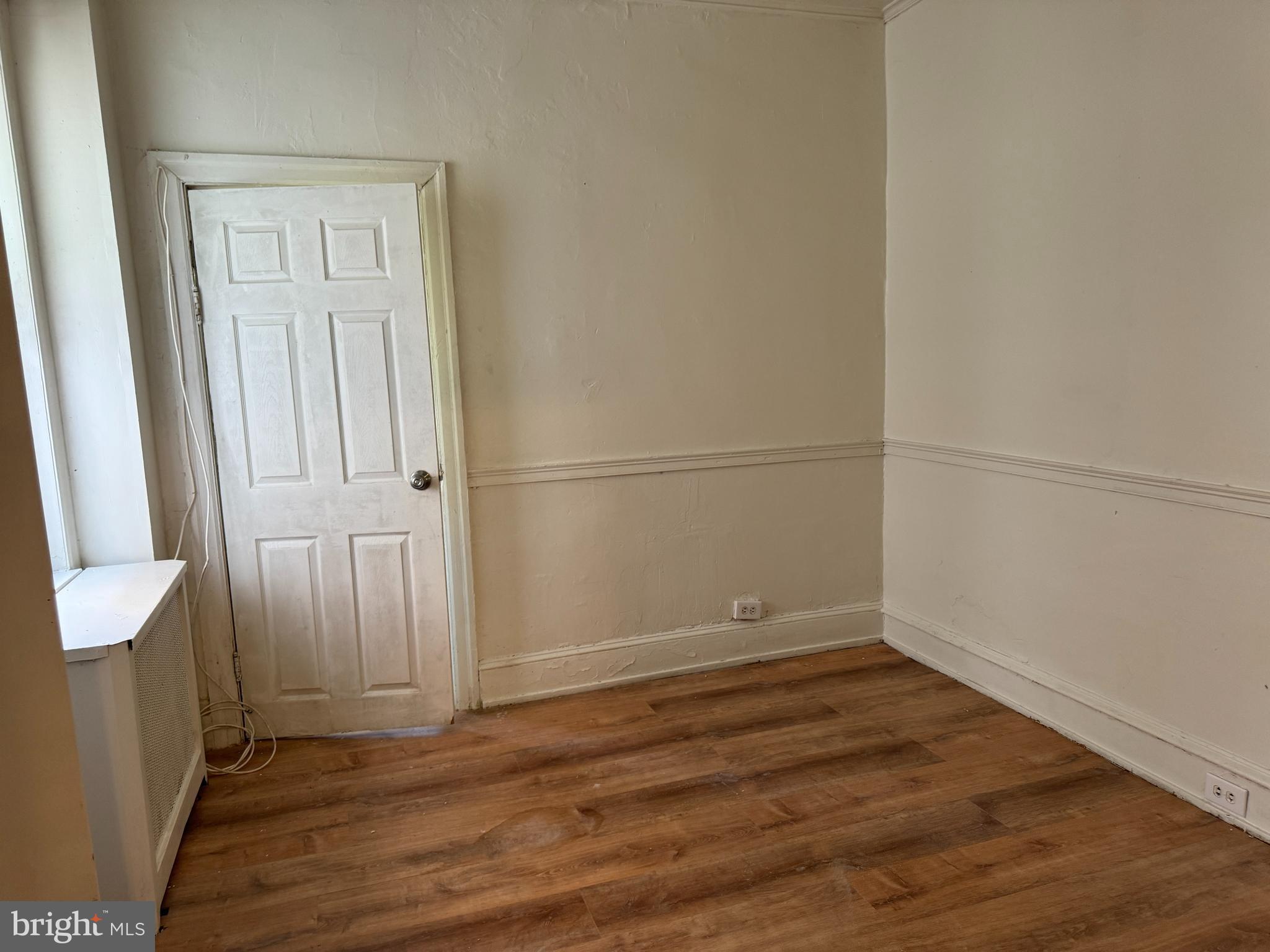 2115 Stenton Avenue Philadelphia, PA 19138 - Photo 3 of 11 an empty room with wooden floor and windows