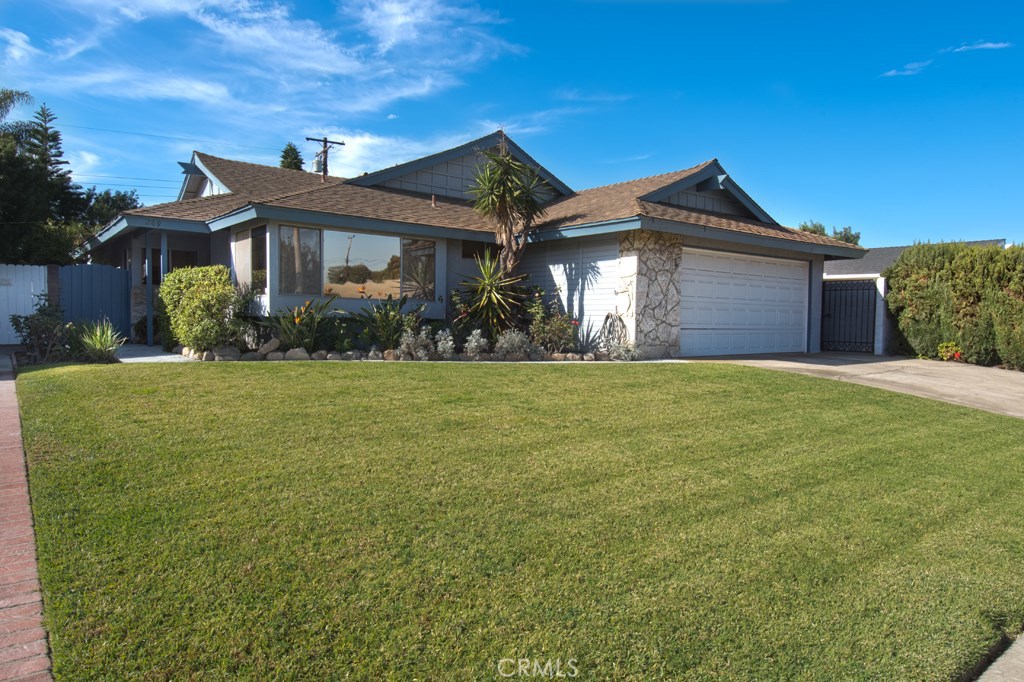 269 Albert Place Costa Mesa, CA 92627 - Photo 2 of 6 a front view of a house with a yard