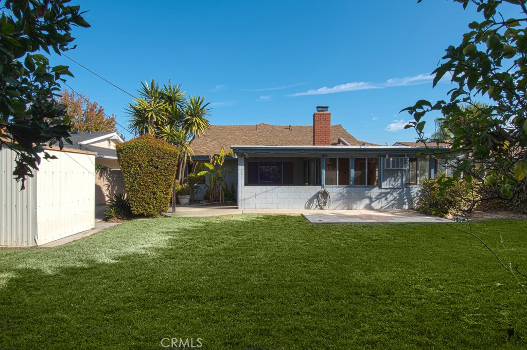 269 Albert Place Costa Mesa, CA 92627 - Photo 4 of 6 a front view of a house with a garden
