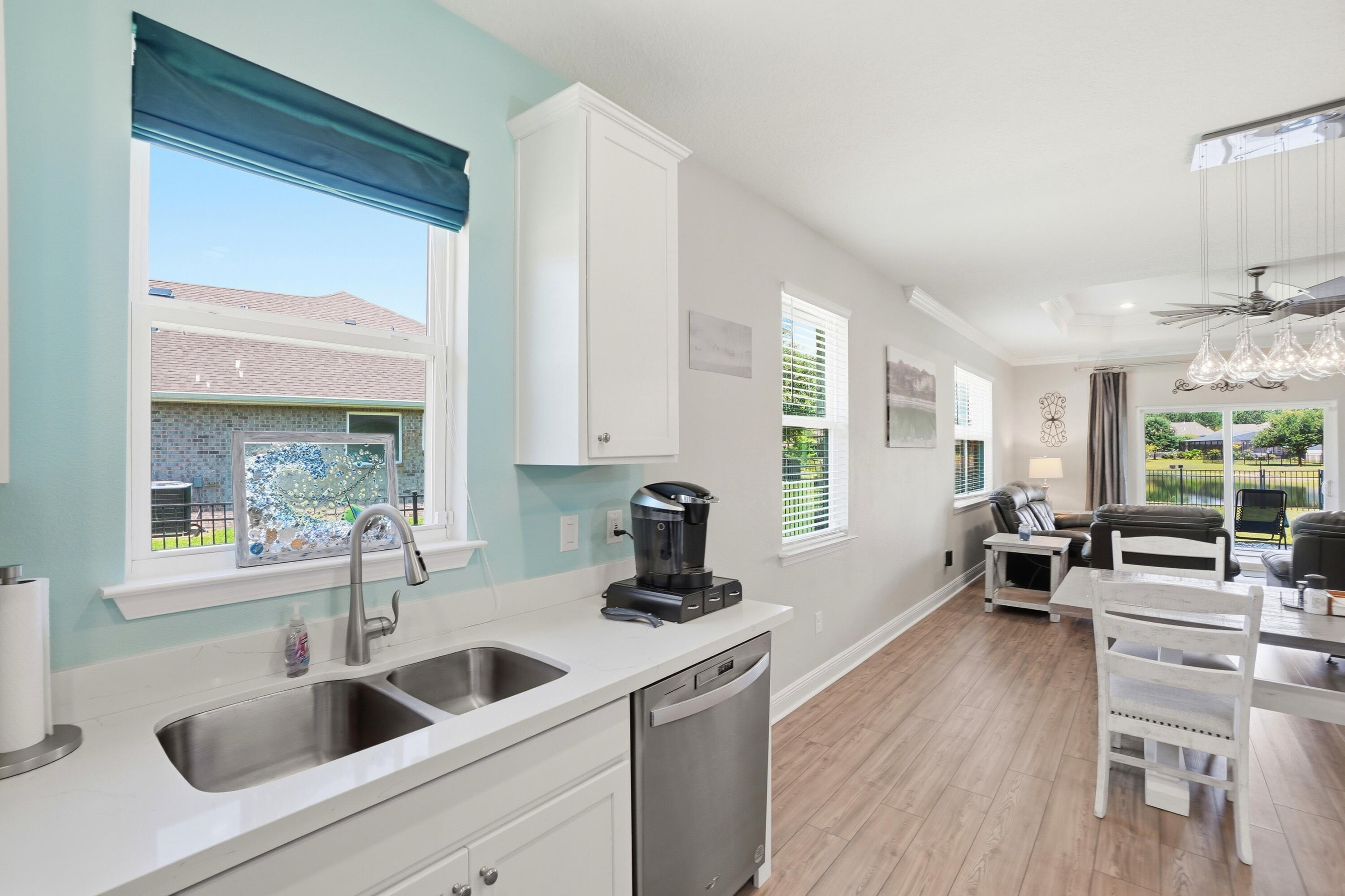 525 Windchime Way Freeport, FL 32439 - Photo 8 of 59 a kitchen with a sink cabinets and wooden floor