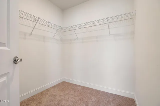 a bathroom with a double vanity sink a mirror and a shower