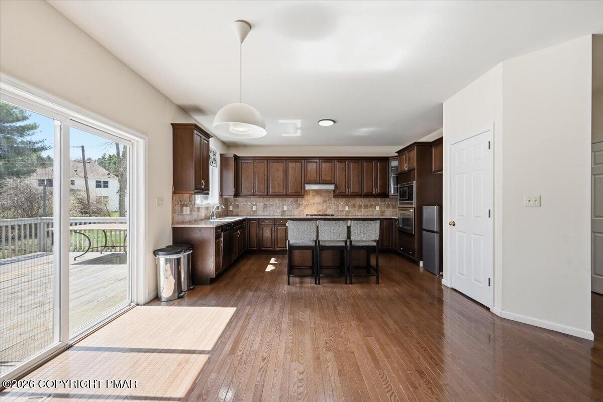 241 Dryden Road Stroudsburg, PA 18360 - Photo 16 of 101 Kitchen/ Eat-In Area/Sliders to Deck