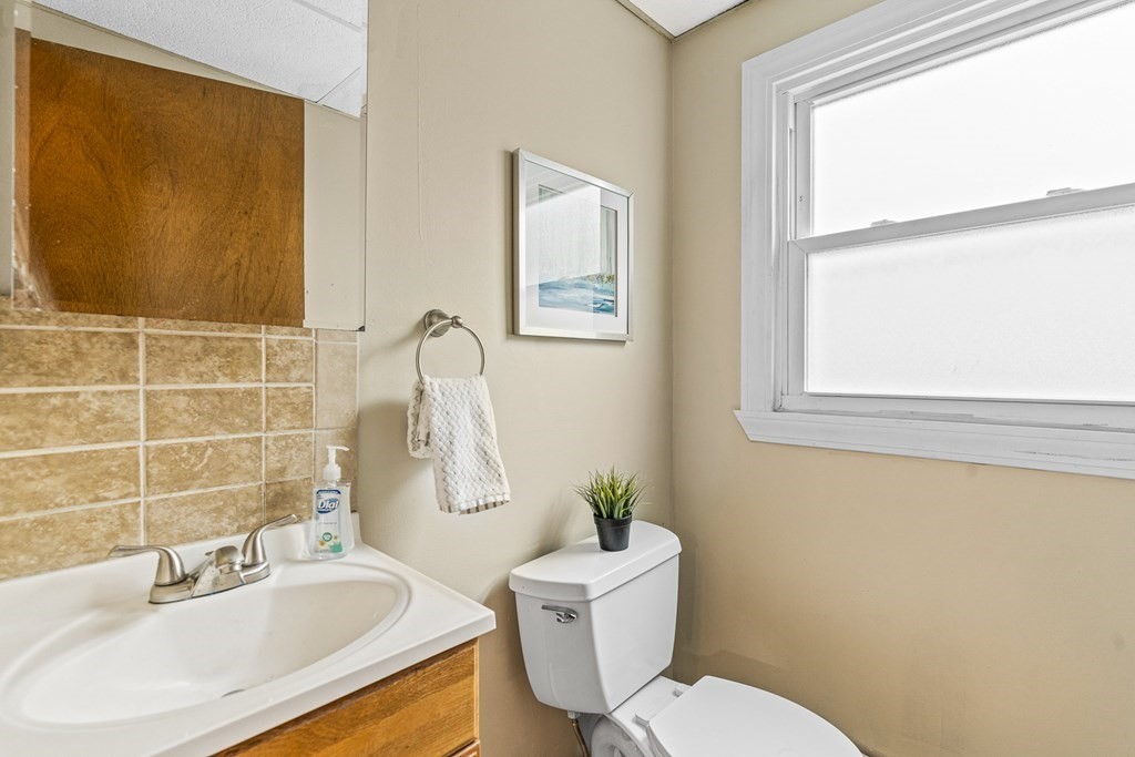 23 Heard Street, Unit 23 Chelsea, MA 02150 - Photo 11 of 27 a bathroom with a sink and a mirror
