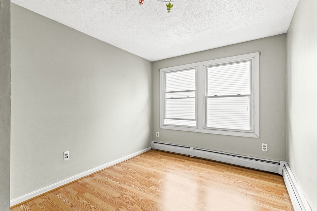 23 Heard Street, Unit 23 Chelsea, MA 02150 - Photo 16 of 27 an empty room with a window