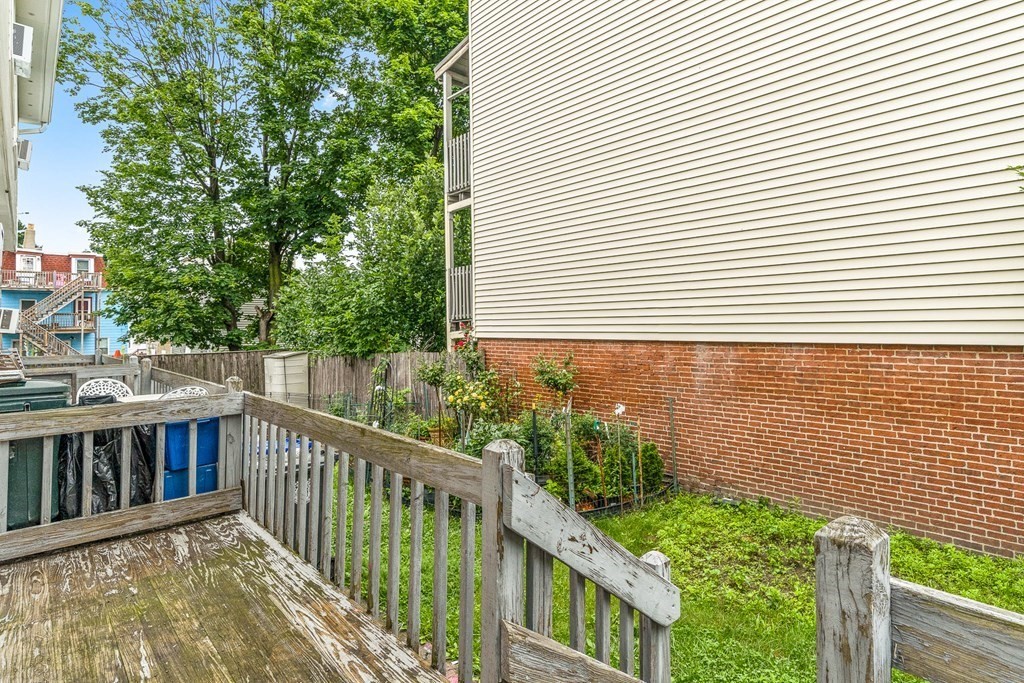 23 Heard Street, Unit 23 Chelsea, MA 02150 - Photo 25 of 27 a view of a wooden fence