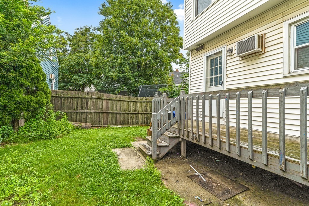 23 Heard Street, Unit 23 Chelsea, MA 02150 - Photo 26 of 27 a view of a backyard with a garden